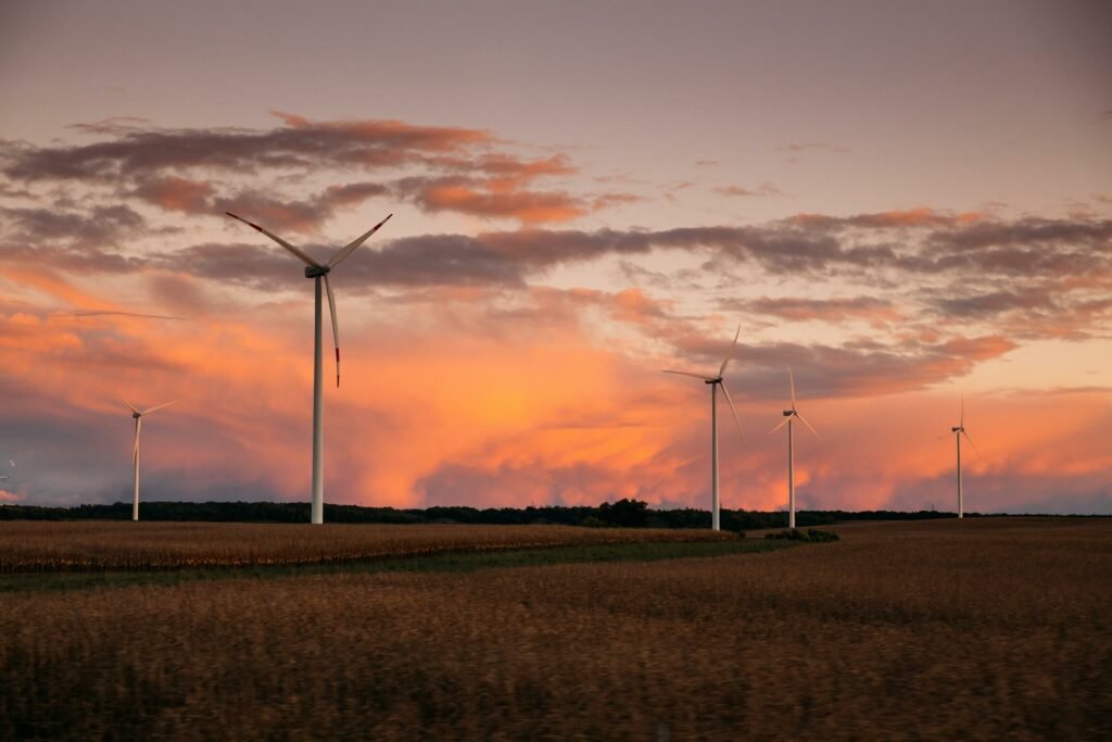 Onshore wind turbine farm at sunset