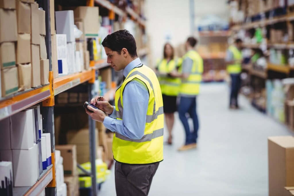 Oil & gas warehouse worker with hand scanner